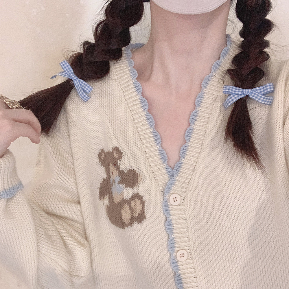 Beige knitted sweater with blue bow  HA0422