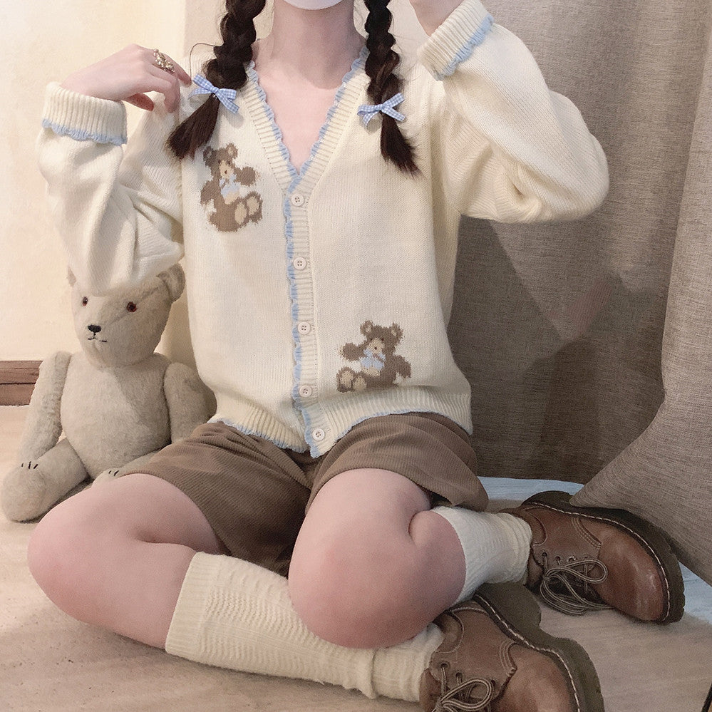 Beige knitted sweater with blue bow  HA0422