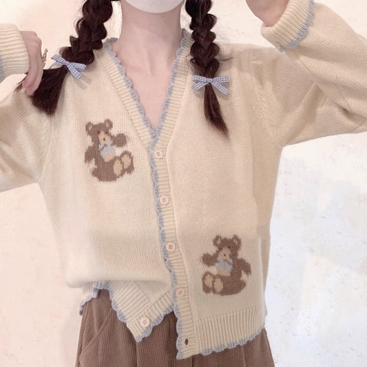 Beige knitted sweater with blue bow  HA0422