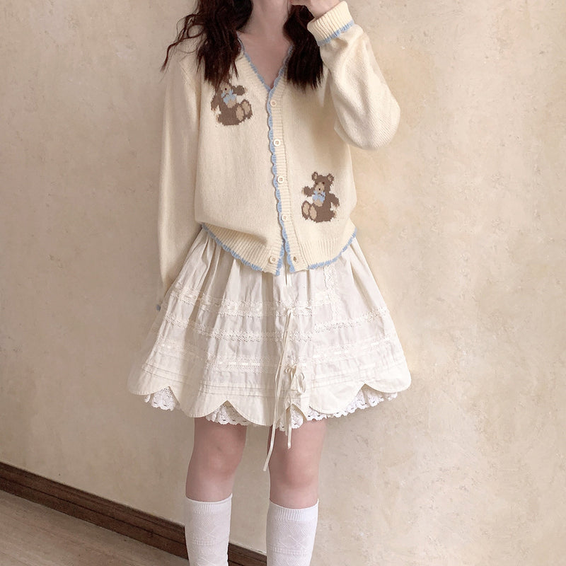 Beige knitted sweater with blue bow  HA0422